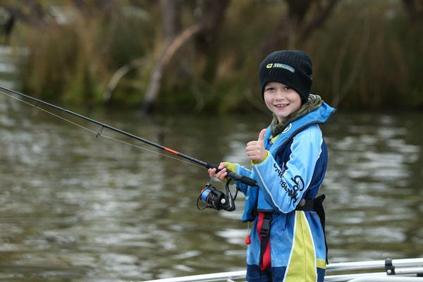 young boy fishing murray cod